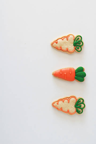 istock Carrot-shaped easter cookies on a white background. Holiday concept with copy space. 2208362264