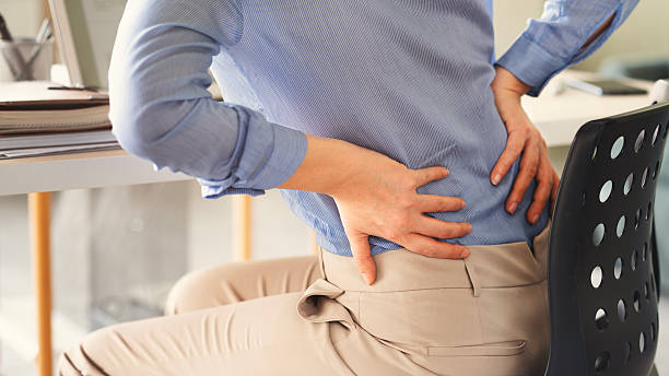 istock Young woman suffering from lower back pain 2208362832