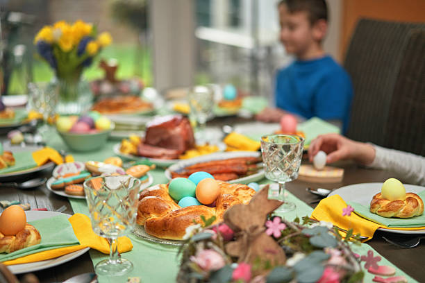 istock Easter Lunch with Roast Pork, Vegetables, Easter Cookies and Easter Cake 2208364220