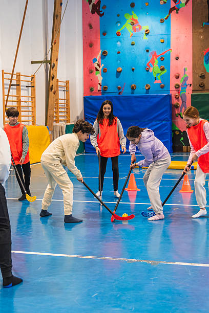 istock Elementary age students playing floorball in school gym 2208366266