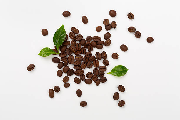istock Roasted coffee beans with leaves on white background,top view 2208366698