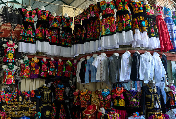 Handmade Mexican blankets hang in a Mexico City arts market