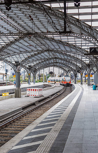 istock Red commuter train arriving on the railway station 2208370368