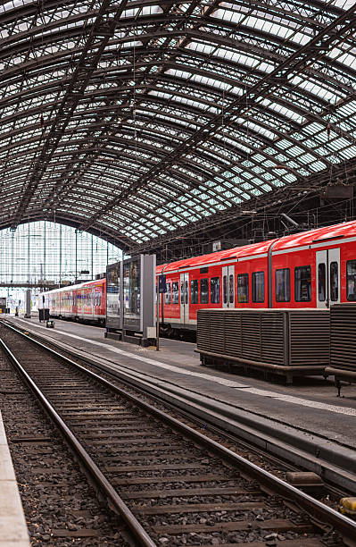istock Red commuter train arriving on the railway station 2208370414
