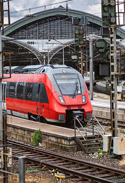 istock Red commuter train arriving on the railway station 2208370438
