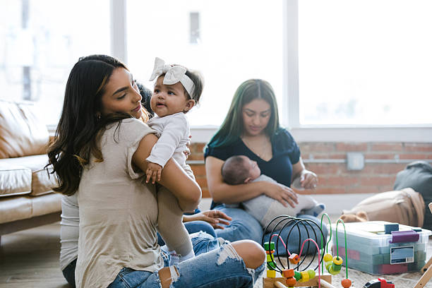 istock Multiracial Mothers Bonding with Babies in a Bright Home 2208371184