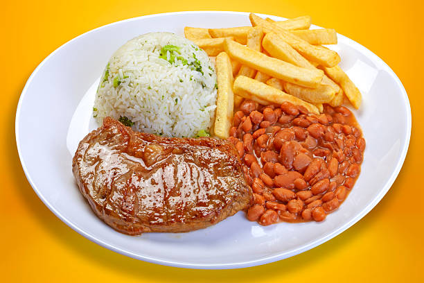 istock Rice, beans, french fries and meat 2208371663