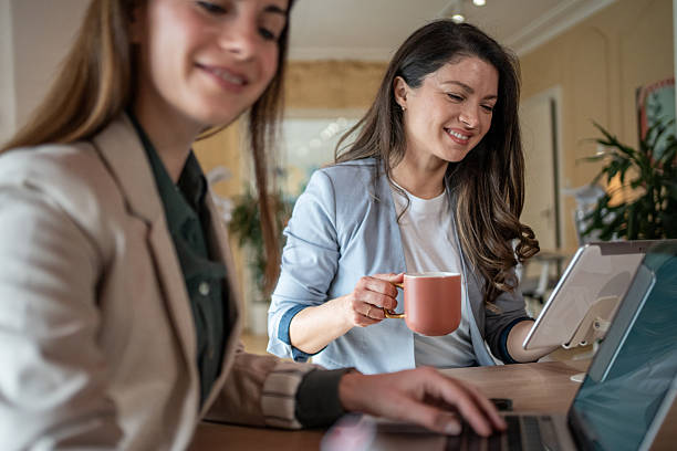 istock Businesswomen working together on project in modern office 2208373222