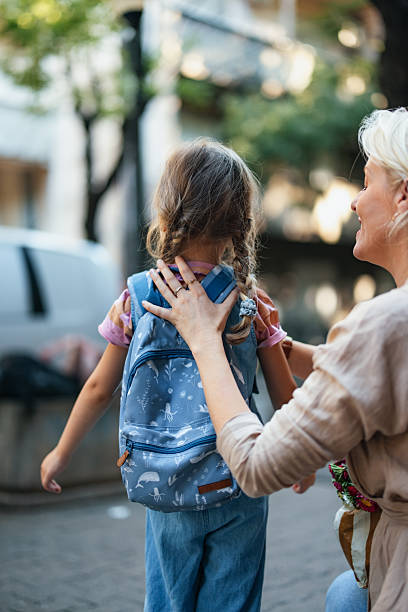 istock Mother Preparing Child for First Day at School 2208374685