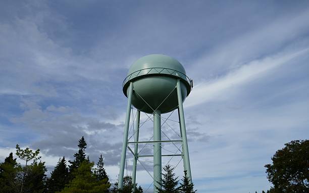 istock Water tower with sky and trees in background 2208374838
