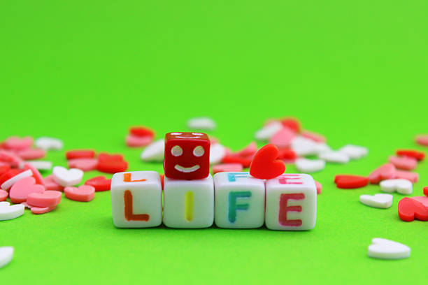 Happy face next to the word life and many hearts