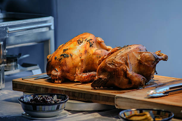 istock roasted chicken in party dinner in warm light from hot lamp 2208384354