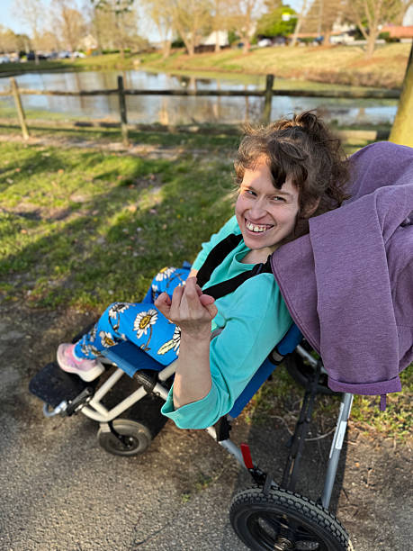istock Disabled young woman out and about in her community 2208390254