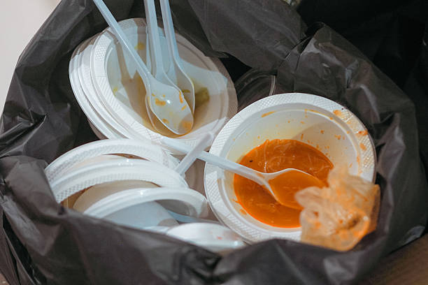 istock used plastic plates in black plastic trash bags 2208392269