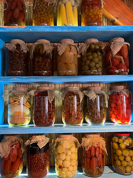 istock A Colorful Array of Beautifully Preserved Jars Displayed on a Rustic Wooden Shelf 2208396503