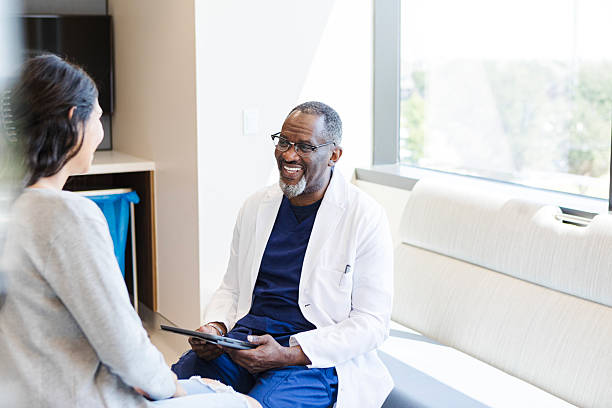 istock Doctor and Patient Discussing Treatment Options on a Tablet 2208397518