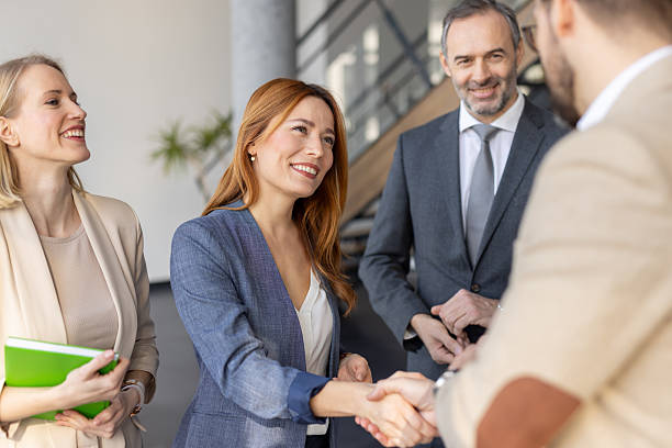 istock Handshake and Smiles in a Corporate Environment 2208402293