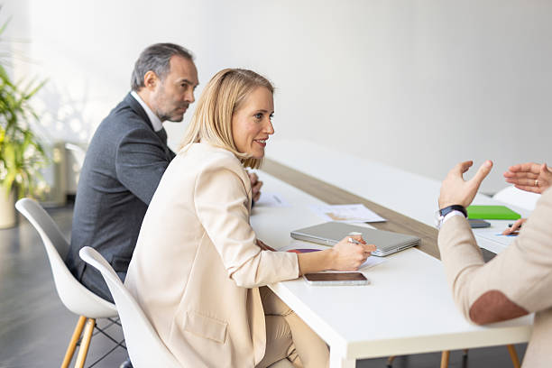 istock Business team collaborating in modern office environment 2208402316