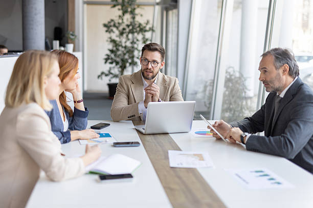 istock Strategically Engaged Professionals in Meeting Environment 2208402320