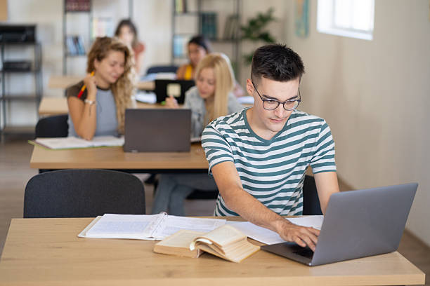 istock An university student is working on laptop in a library 2208402399