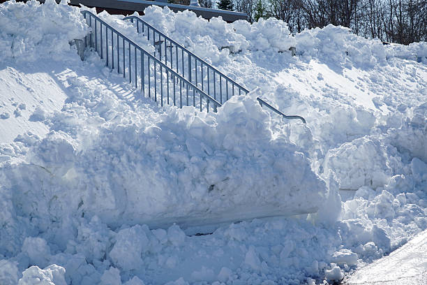 istock plowed snow pile in parking lot after blizzard 2208402753