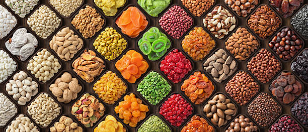 istock assorted nuts and dried fruits, colorful food background. 2208411557