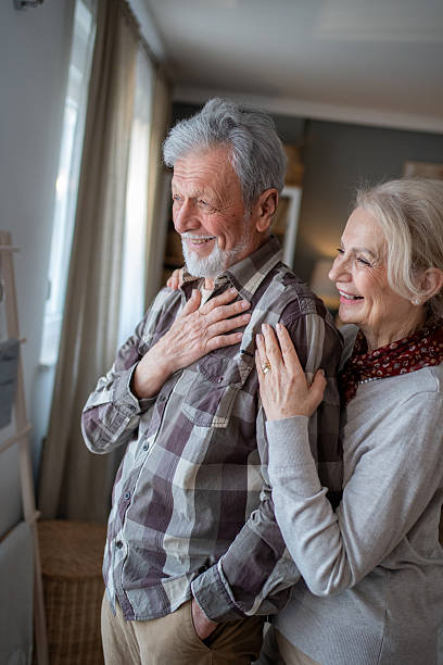istock Happy senior couple sharing a tender moment at home 2208417062