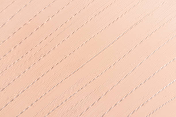 Beautiful abstract background with parallel oblique lines of liquid foundation. A sample texture of a beige tone tonal texture. cosmetic layout
