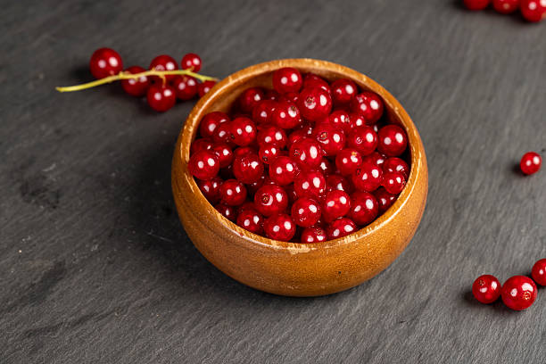 istock harvest small red currant berries on the kitchen table in a bowl 2208420580