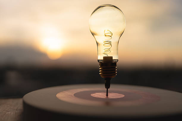 istock Light bulb with arrow of darts on dart board. Concept of finding problem solving or business development, key to success. 2208421755