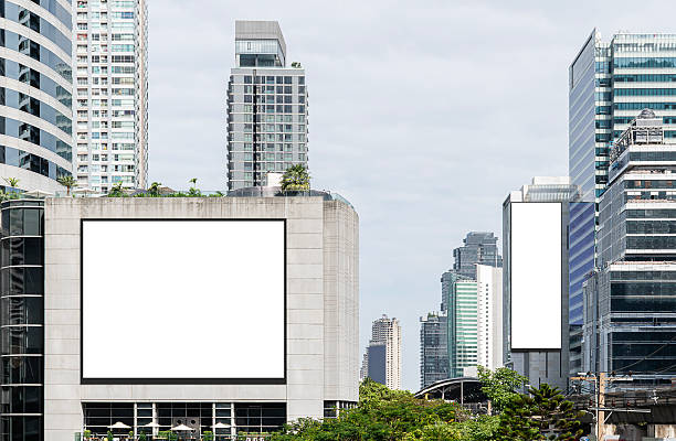 istock Two white mock up horizontal and vertical large LED display billboard on tower building. Clipping path for mockup 2208424045