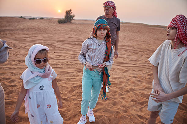 istock Beautiful active senior with grandchildren in Dubai desert 2208424954