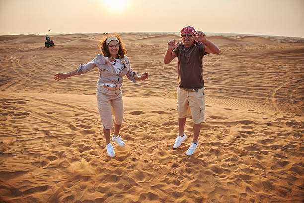 istock Beautiful active seniors in Dubai desert 2208425012