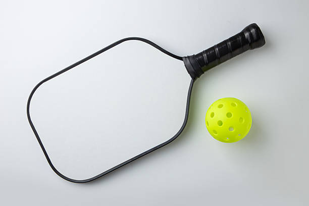 istock Pickleball Paddle and Ball on a white background 2208427655