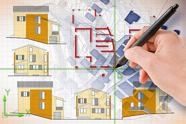 istock Architect drawing with a digital pen and CAD software (Computer-Aided-Design) a new residential building over an imaginary cadastral map of territory. 2208427830