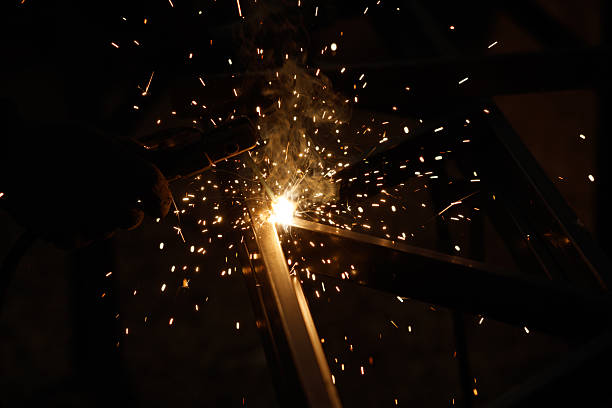 istock A man is welding metal with sparks flying 2208428756