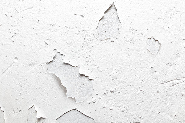 istock The wall is covered in holes and peeling paint 2208428844