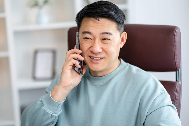 istock Asian man Smiling having talk with his clients 2208429029