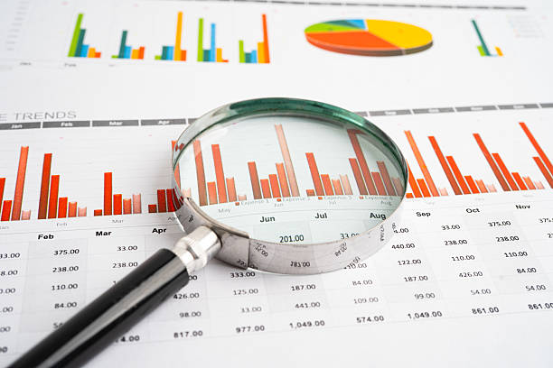istock Magnifying glass on charts graphs paper. Financial development, Banking Account, Statistic, Investment Analytic research data economy. 2208430205