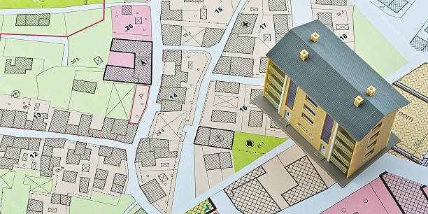 istock Imaginary cadastral map and general urban plan with cadastral parcels, urban destinations, vacant land plots and condominium residential building 2208430533