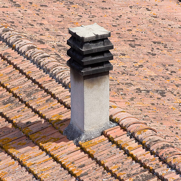 Old roof with tile called marseilles with chimney - view from top