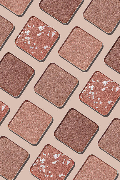 istock Cosmetics texture pattern, makeup palette vivid neutral color eye shadow, square eye powder swatches. Female cosmetic and beauty products, aesthetic minimal beauty photo, shimmer eyeshade, top view 2208432618