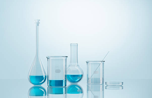 istock 3D Laboratory glassware containing blue liquid conducting chemical experiments 2208433895