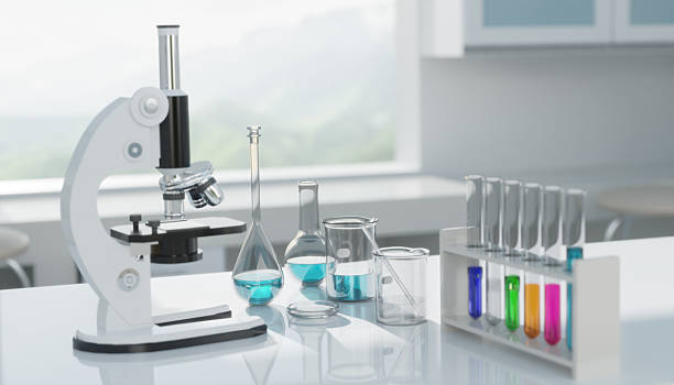istock 3D Laboratory microscope with test tubes and beakers stands on table for scientific experiment 2208433896