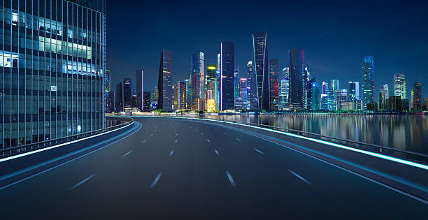 3D Empty asphalt road and modern city skyline panorama in shenzhen at night Futuristic highway in the financial district leading to the illuminated skyscrapers. 3D rendering shenzhen technology stock pictures, royalty-free photos & images