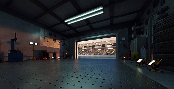 istock 3D Garage opening onto a crowded stadium at sunset: motorsport pit stop 2208434792