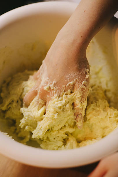 istock Manually kneading pizza dough. High quality photo 2208435171