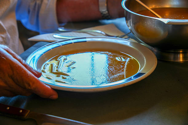 Empty plate with stains of orange sauce after finishing. Dirty plate, empty restaurant bowl after
