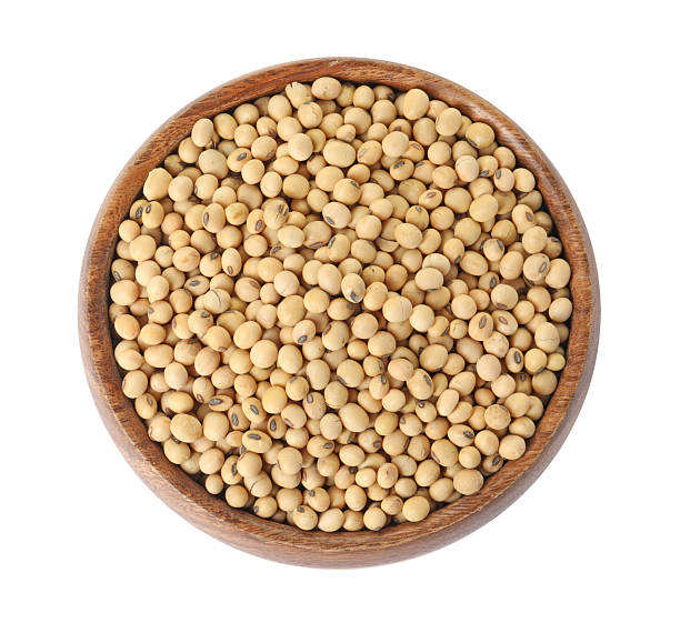 istock Soy beans in bowl isolated on white, top view 2208438487