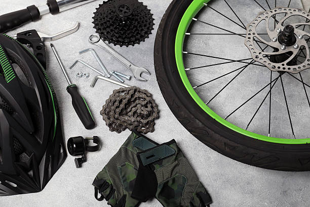 istock Parts of bicycle and tools on grey background 2208438613